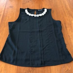 Black top with pearl and gemstone accents